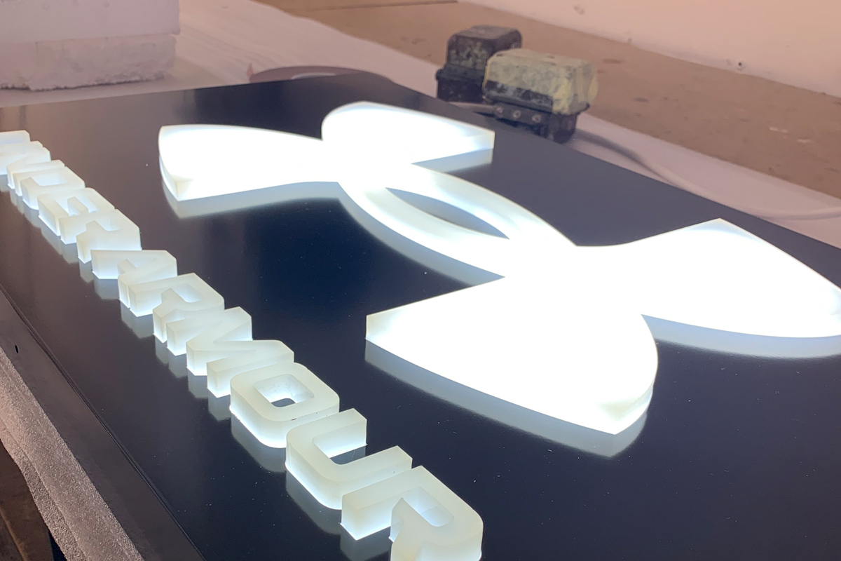 Undwer Armour sign in production